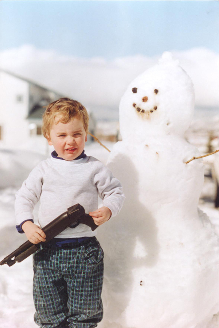 Dave Kinskey as a child with a snowman